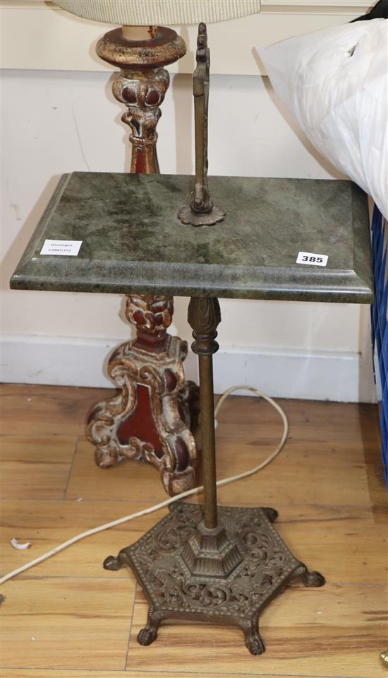 An Italian giltwood altar stick and a marble and cast iron stand, overall height 77cm